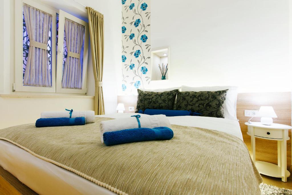 Posteľ alebo postele v izbe v ubytovaní Dalti Center Apartment