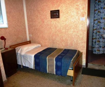 Postel nebo postele na pokoji v ubytování Hotel Bolognese