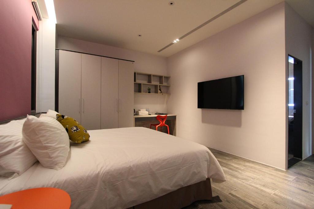 TV a/nebo společenská místnost v ubytování Funson Hotel