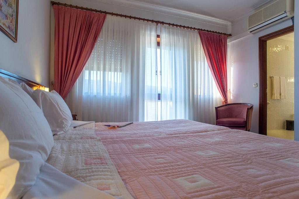 Postel nebo postele na pokoji v ubytování Hotel Boavista I