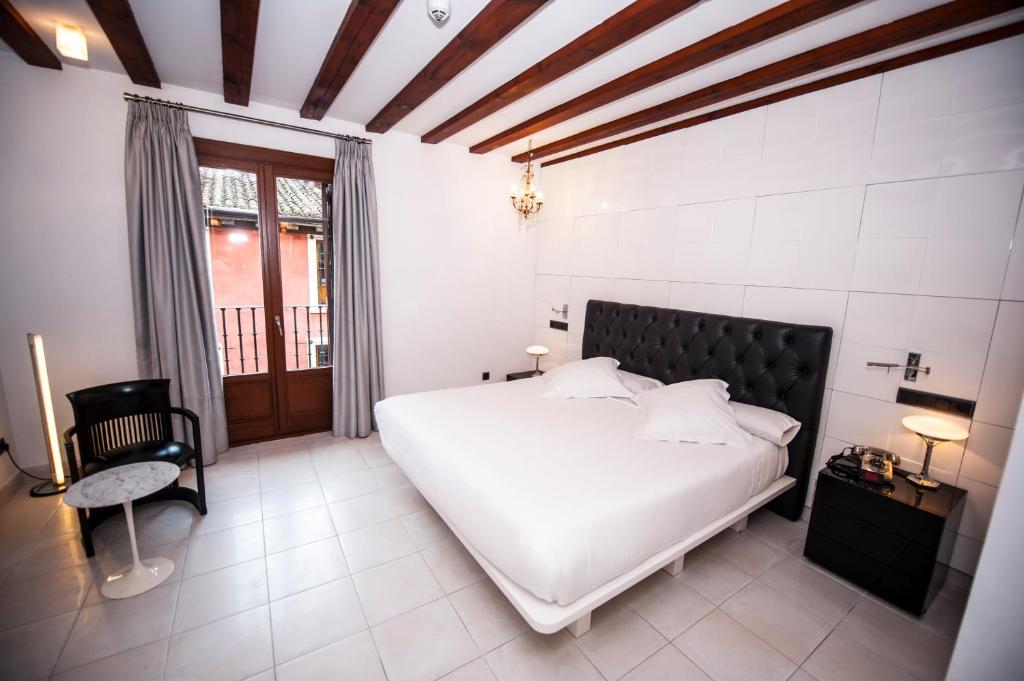 Posada del León de Oro Boutique Hotelにあるベッド
