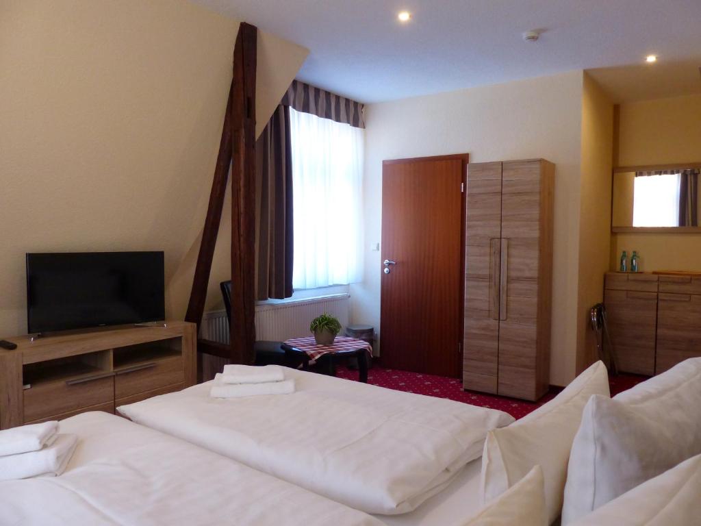 Voodi või voodid majutusasutuse Hotel Friedchen mit eigener Fleischerei toas