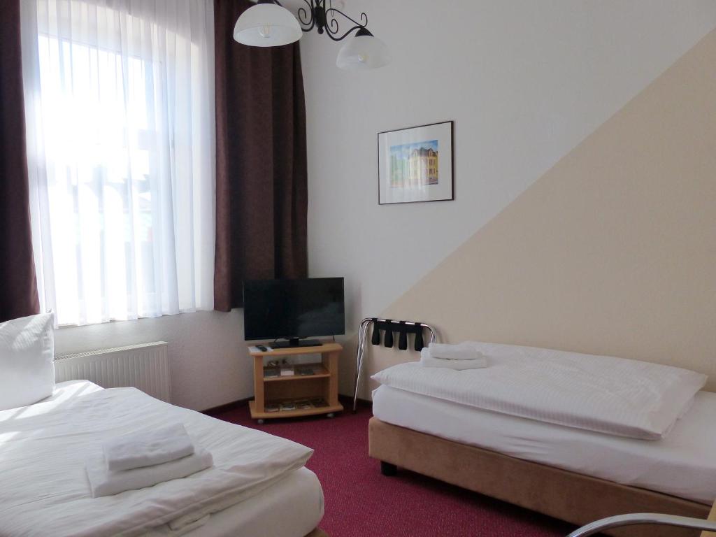 Voodi või voodid majutusasutuse Hotel Friedchen mit eigener Fleischerei toas