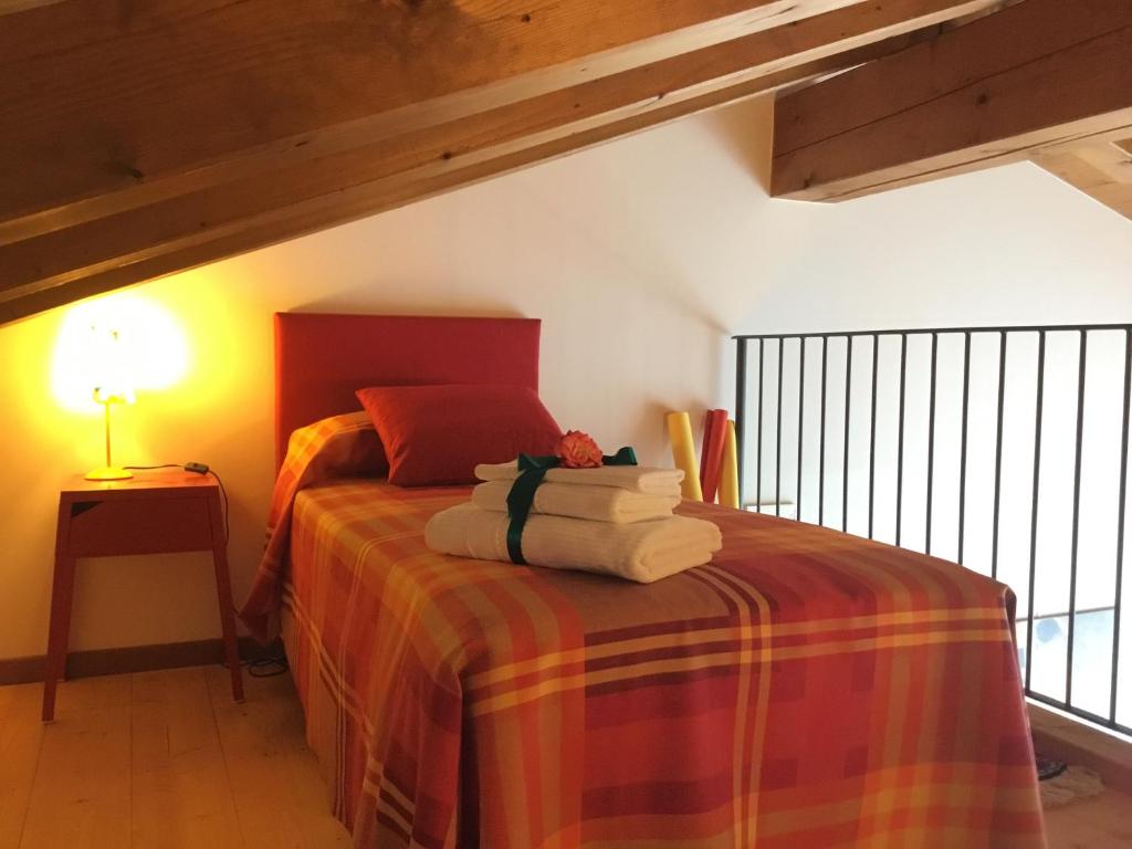 Łóżko lub łóżka w pokoju w obiekcie Casa Rebellato