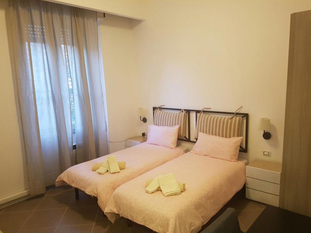 Postel nebo postele na pokoji v ubytování B&B Piazza Dante Nuoro