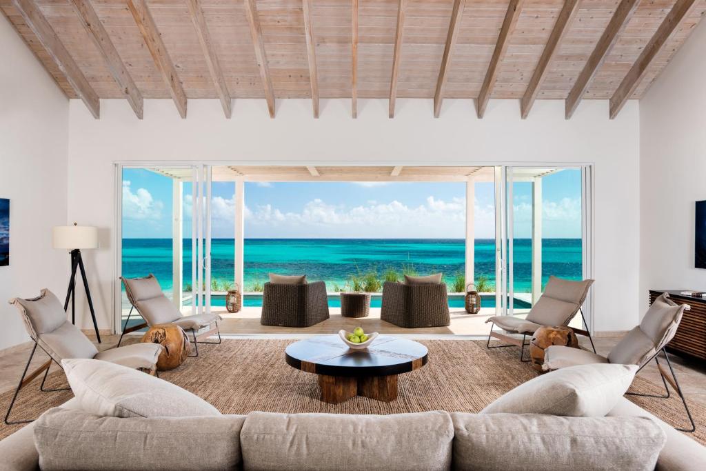 a living room with a view of the ocean at Sailrock South Caicos - Island Hop Flight Included in South Caicos