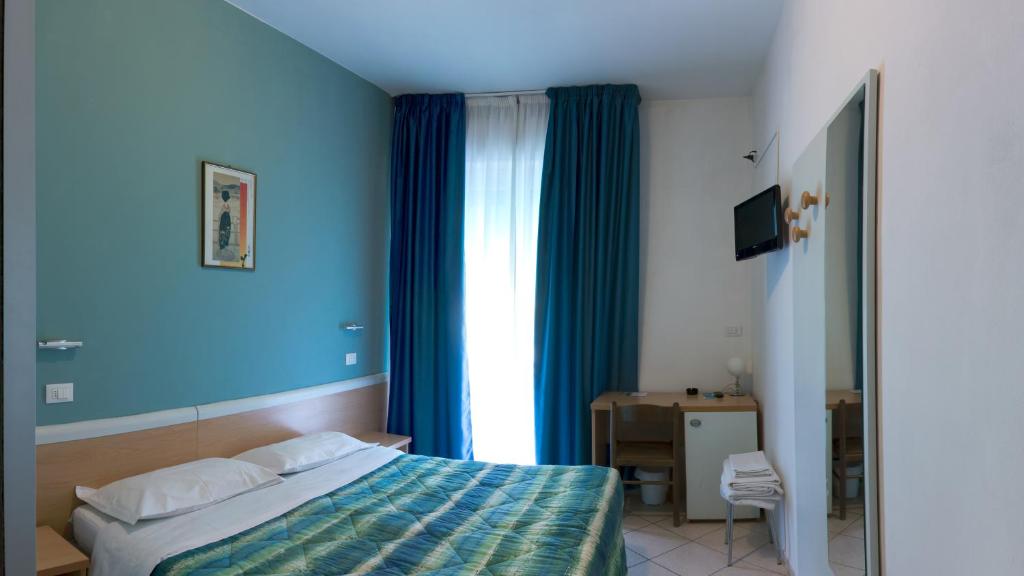 Postel nebo postele na pokoji v ubytování Hotel Savina