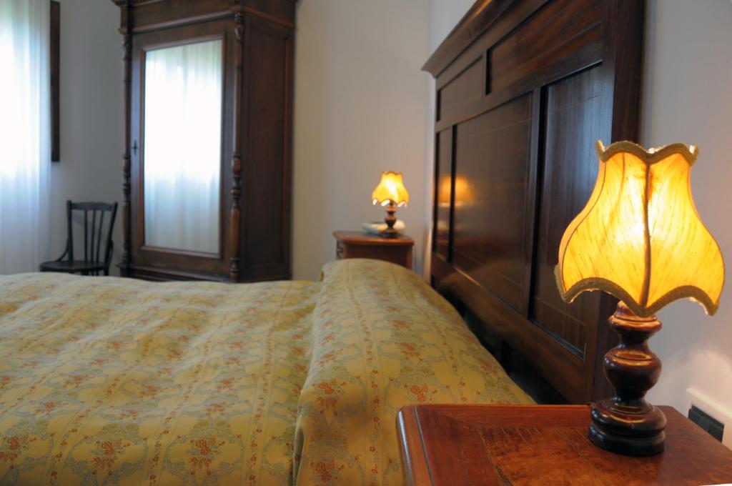 Posteľ alebo postele v izbe v ubytovaní Agriturismo-R&B Corte dei Gioghi