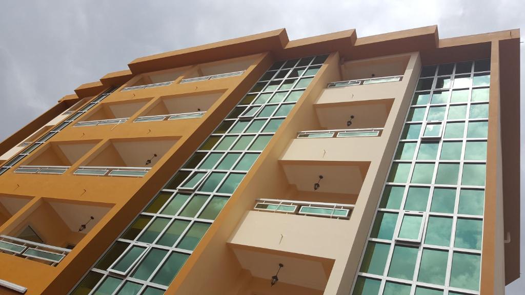 a tall building with many windows at Résidence hôtelière La Roseline in Yaoundé