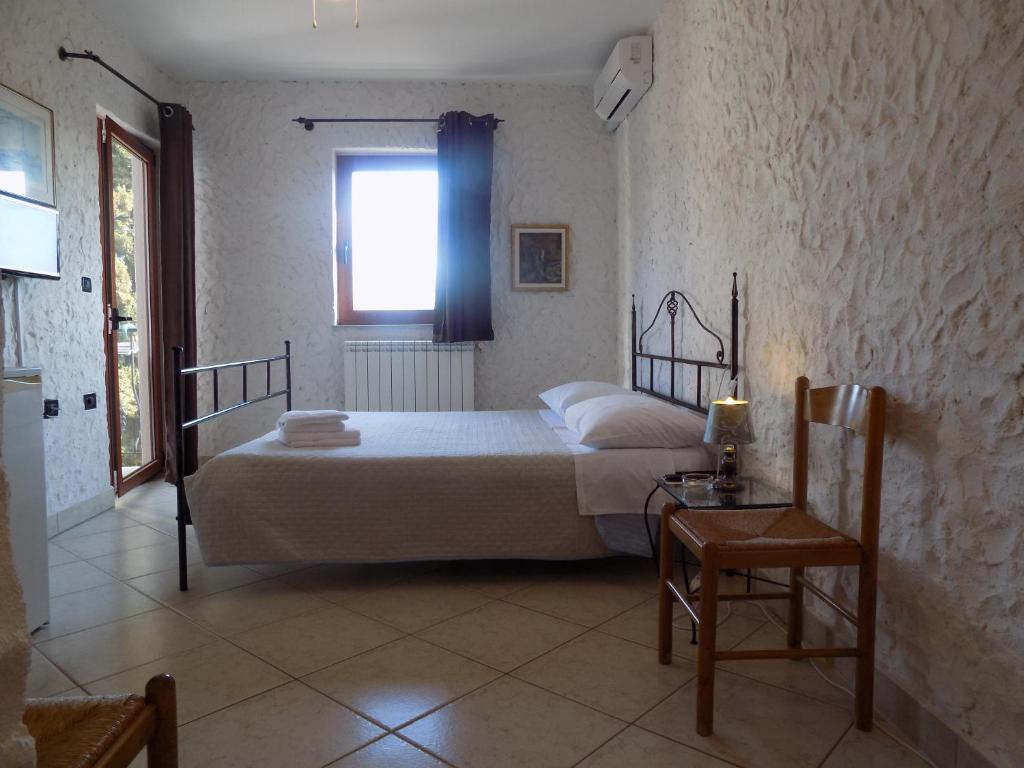 Postel nebo postele na pokoji v ubytování Rooms and Apartment Feral