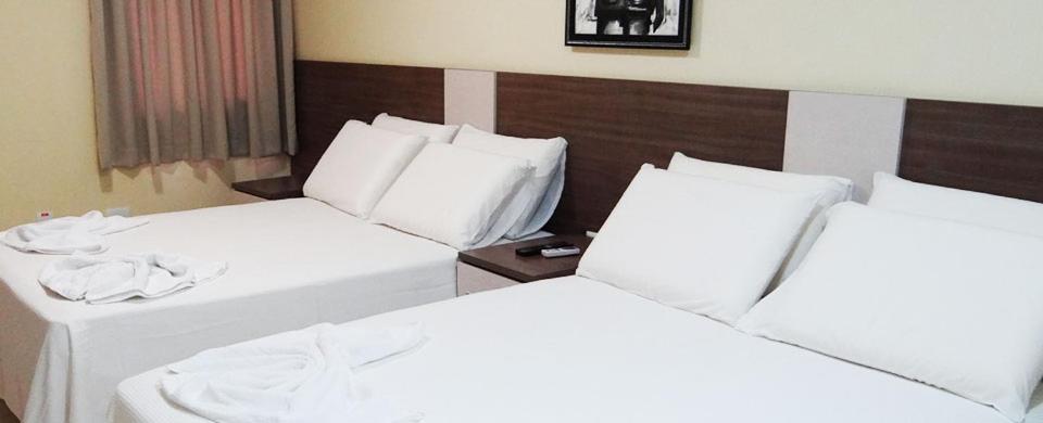 Postel nebo postele na pokoji v ubytování Hotel Moura