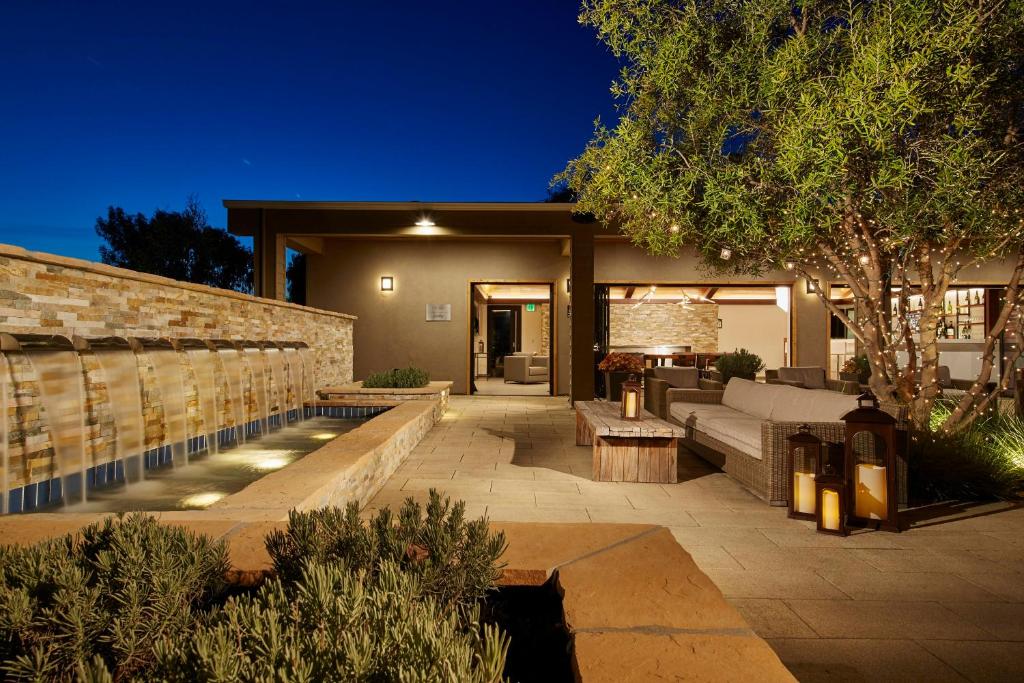 a home with a patio with a couch and a table at The Nest Hotel Palo Alto in Palo Alto