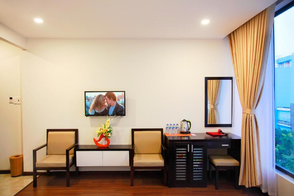TV a/nebo společenská místnost v ubytování May Hotel