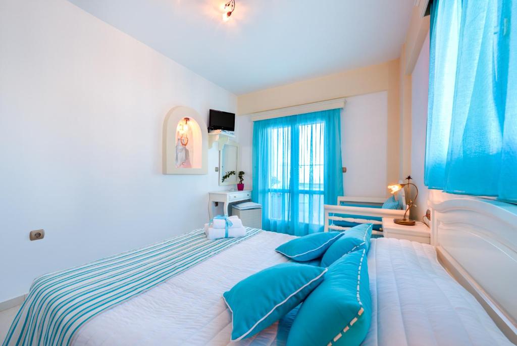 Postel nebo postele na pokoji v ubytování Ellinon Thea Boutique Hotel
