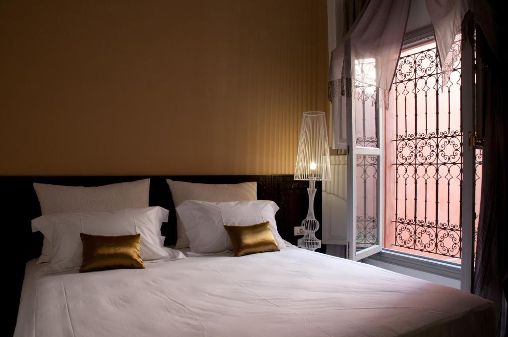Postel nebo postele na pokoji v ubytování Riad Nashira & Spa