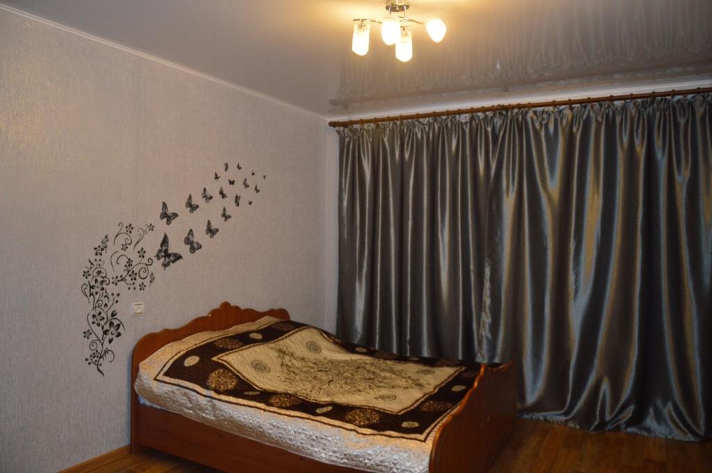 Krevet ili kreveti u jedinici u okviru objekta Apartment on Chkalova 42