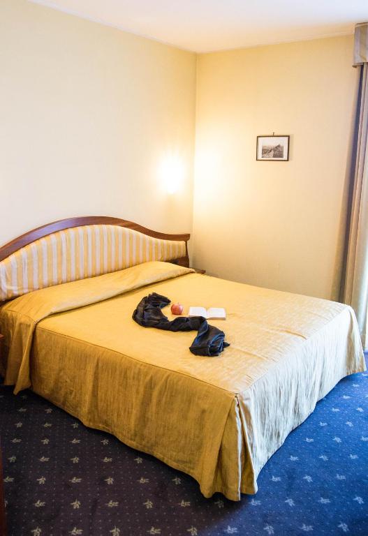 Postel nebo postele na pokoji v ubytování Hotel San Clemente
