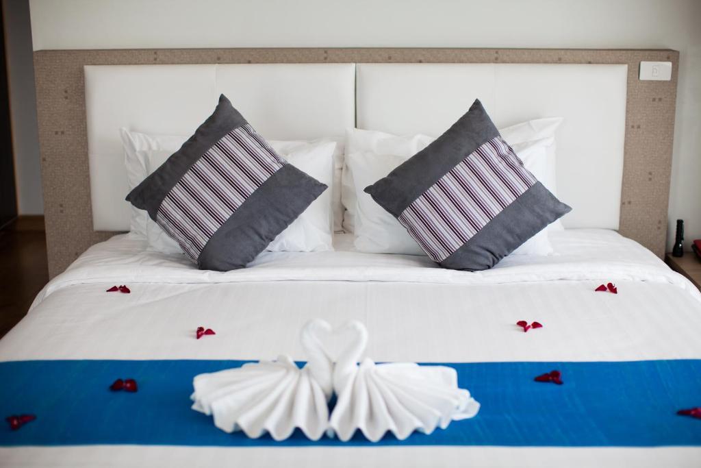 Postel nebo postele na pokoji v ubytování Prajaktra Design Hotel