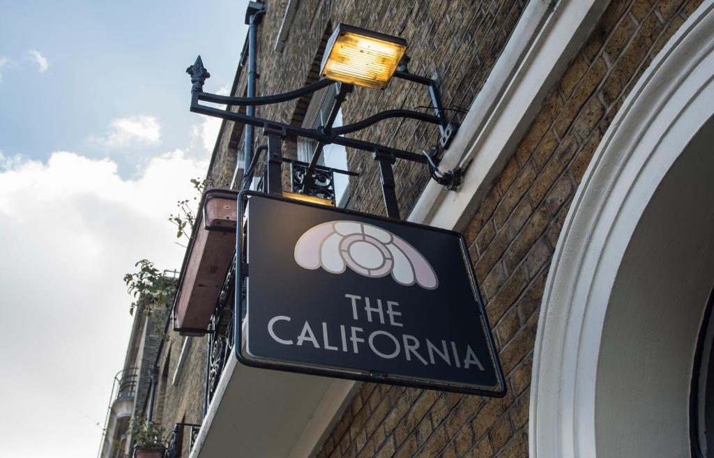 a sign on the side of a building at The California - London Kings Cross in London