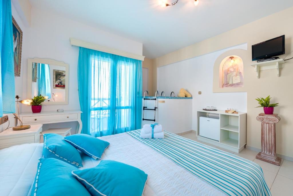 Postel nebo postele na pokoji v ubytování Ellinon Thea Boutique Hotel