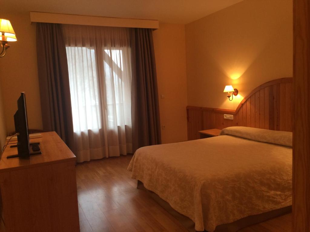 Postel nebo postele na pokoji v ubytování Hotel Estanys Blaus