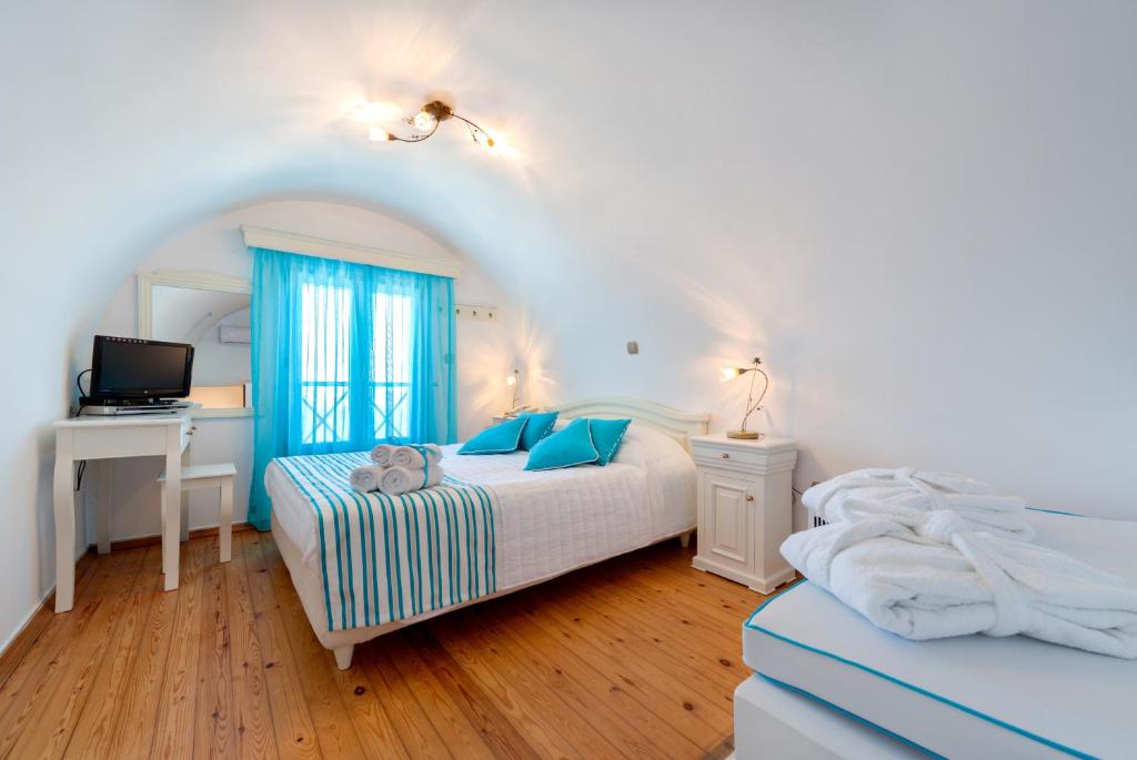 Postel nebo postele na pokoji v ubytování Ellinon Thea Boutique Hotel