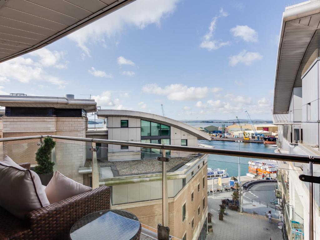 a balcony with a view of a harbor at Sailaway in Poole