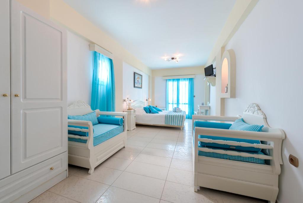 Postel nebo postele na pokoji v ubytování Ellinon Thea Boutique Hotel