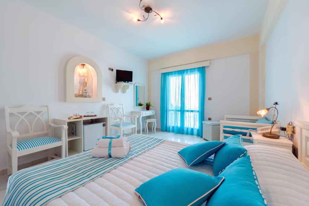 Postel nebo postele na pokoji v ubytování Ellinon Thea Boutique Hotel