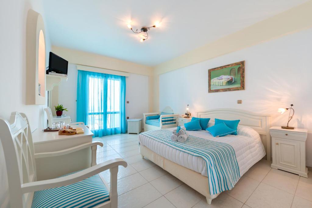 Postel nebo postele na pokoji v ubytování Ellinon Thea Boutique Hotel