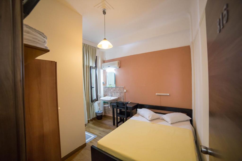 Ένα ή περισσότερα κρεβάτια σε δωμάτιο στο Ξενοδοχείο Τέμπη