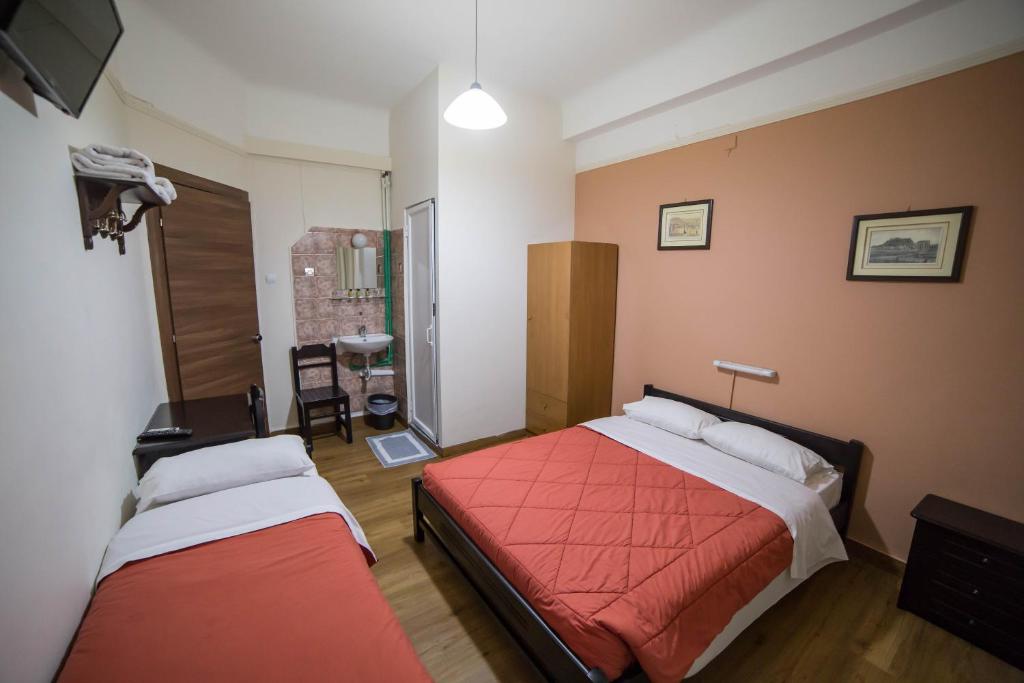 Posteľ alebo postele v izbe v ubytovaní Tempi Hotel