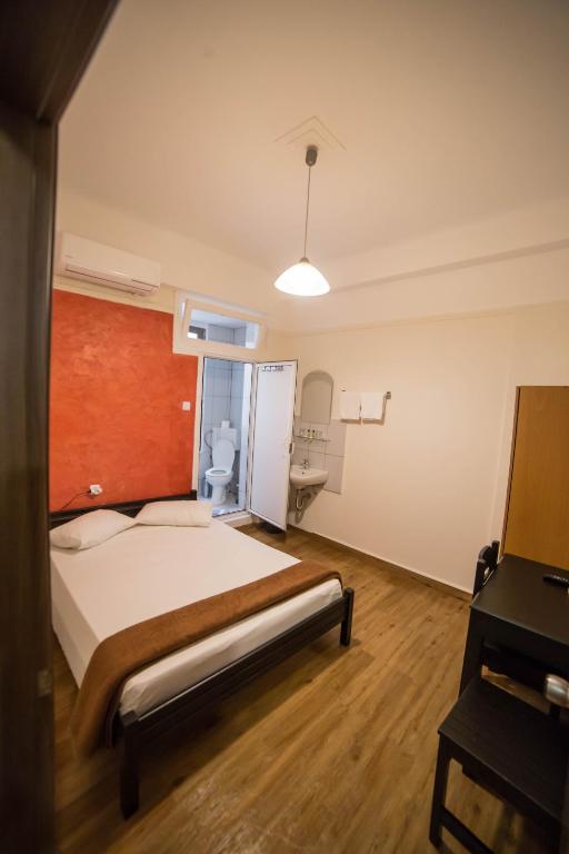 Posteľ alebo postele v izbe v ubytovaní Tempi Hotel