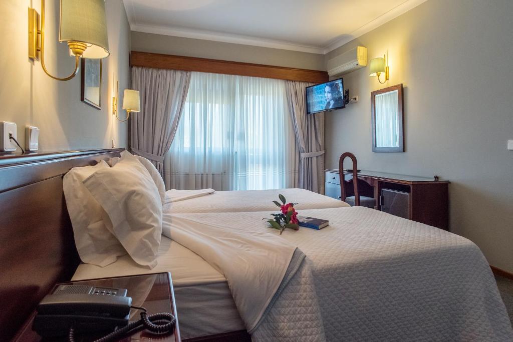Postel nebo postele na pokoji v ubytování Hotel Boavista II