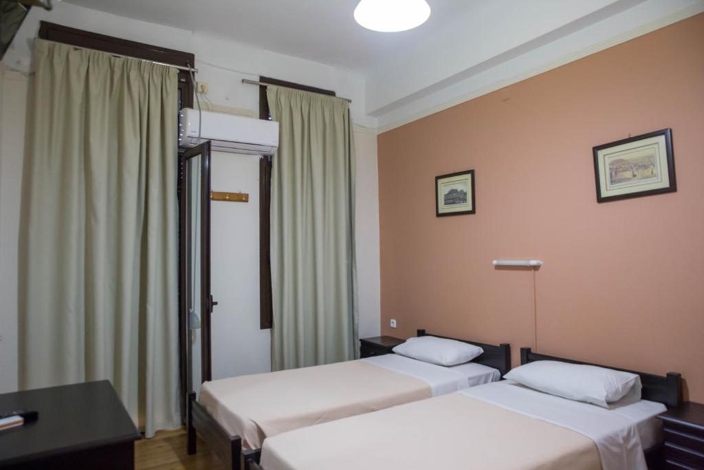 Posteľ alebo postele v izbe v ubytovaní Tempi Hotel