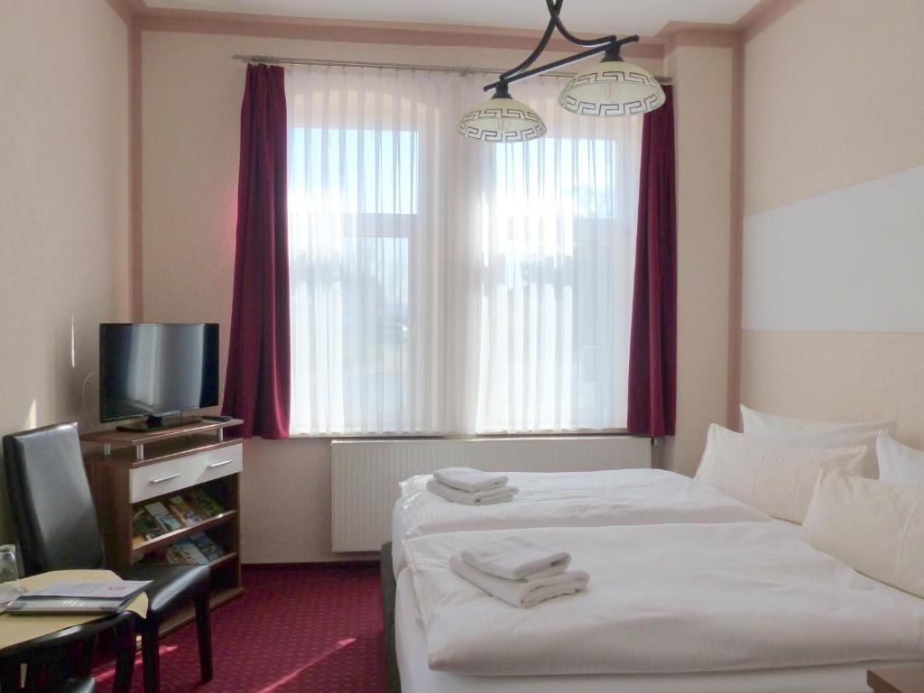 Voodi või voodid majutusasutuse Hotel Friedchen mit eigener Fleischerei toas