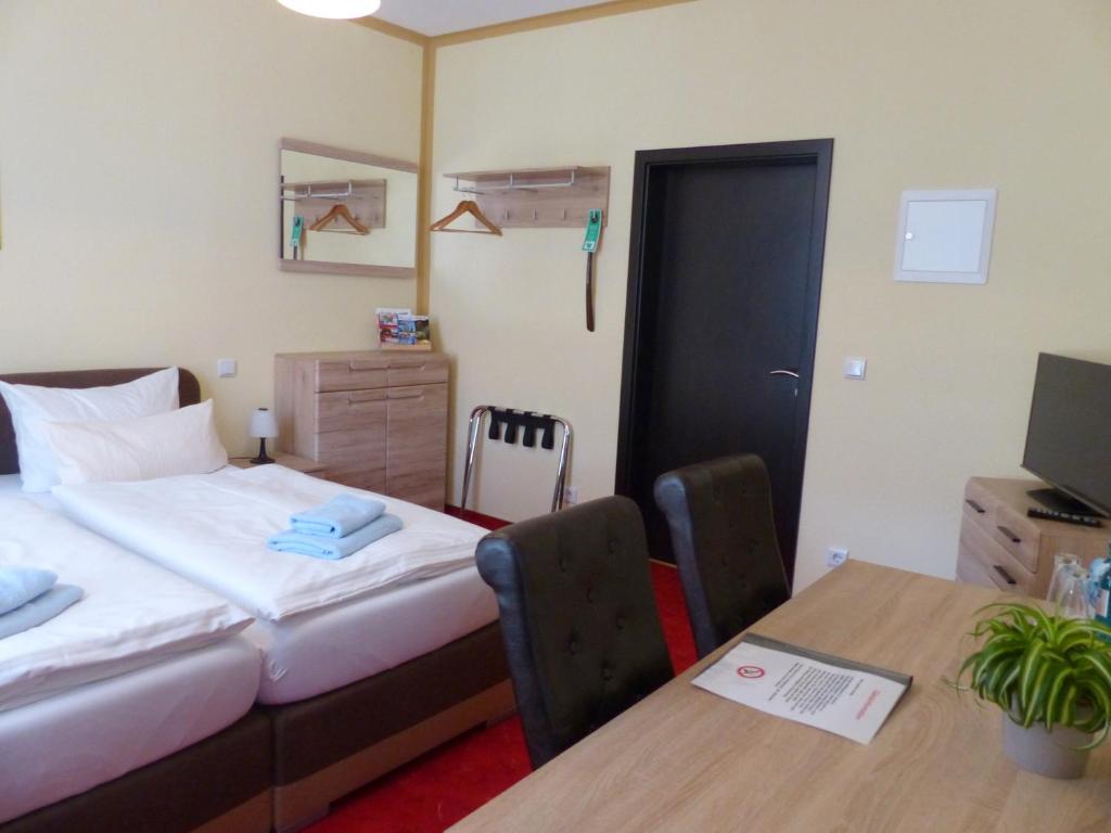 Voodi või voodid majutusasutuse Hotel Friedchen mit eigener Fleischerei toas