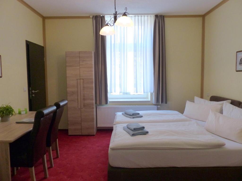 Voodi või voodid majutusasutuse Hotel Friedchen mit eigener Fleischerei toas