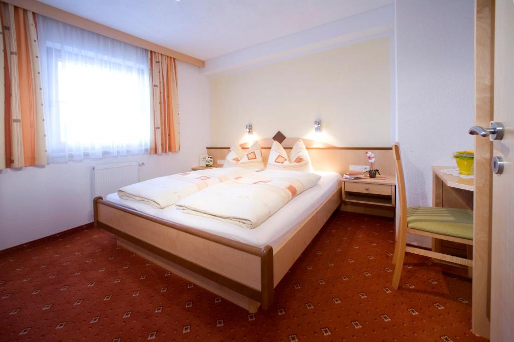 Postel nebo postele na pokoji v ubytování Apart Fankhauser