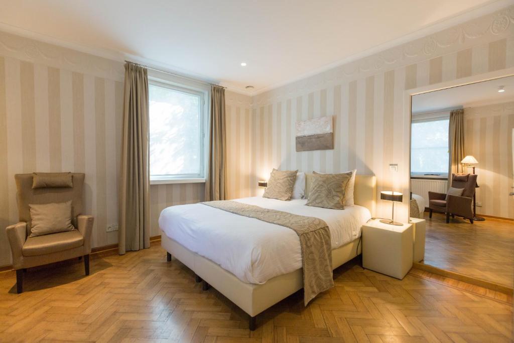 Cama o camas de una habitación en Hotel Astoria Gent