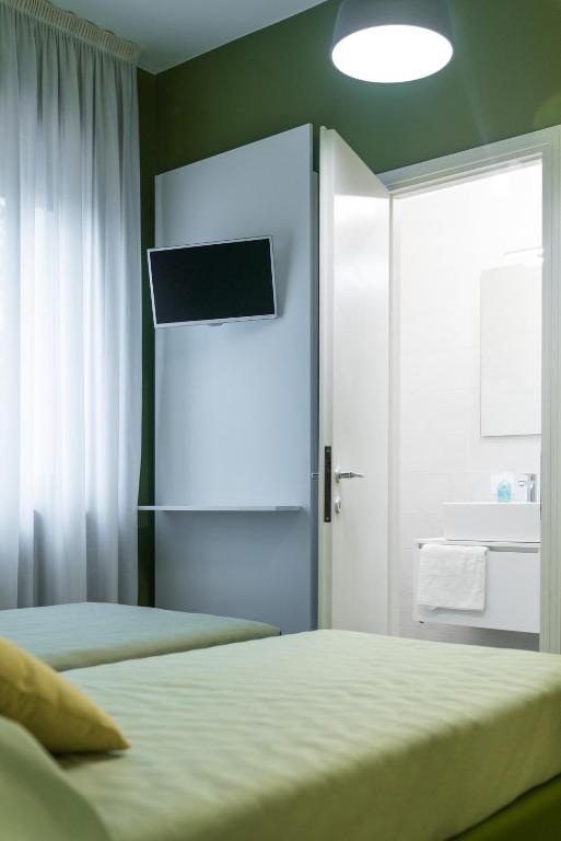 Postel nebo postele na pokoji v ubytování Hotel La Diga Altomincio