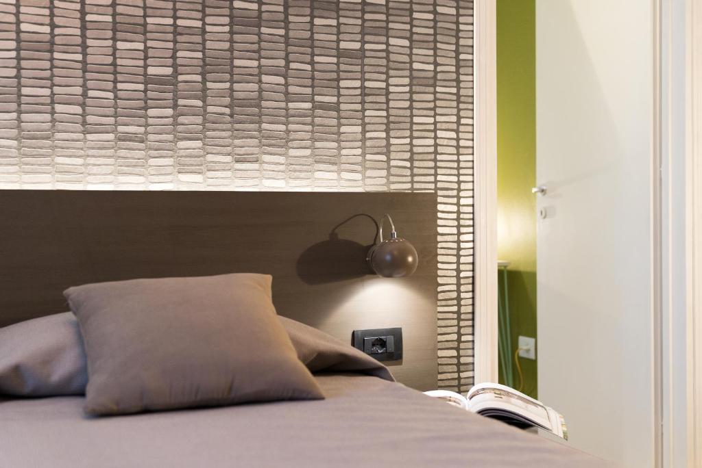 Postel nebo postele na pokoji v ubytování Hotel La Diga Altomincio
