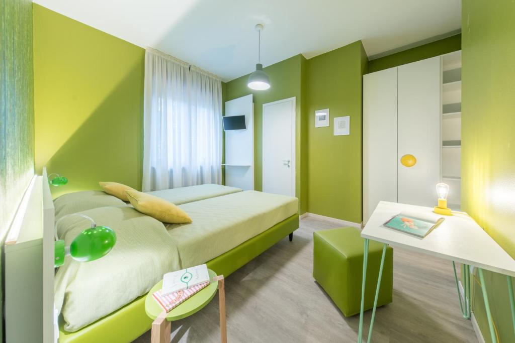 Postel nebo postele na pokoji v ubytování Hotel La Diga Altomincio