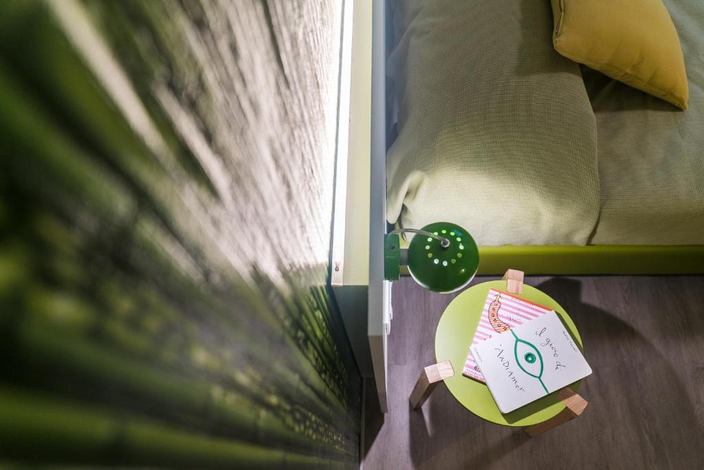 Postel nebo postele na pokoji v ubytování Hotel La Diga Altomincio