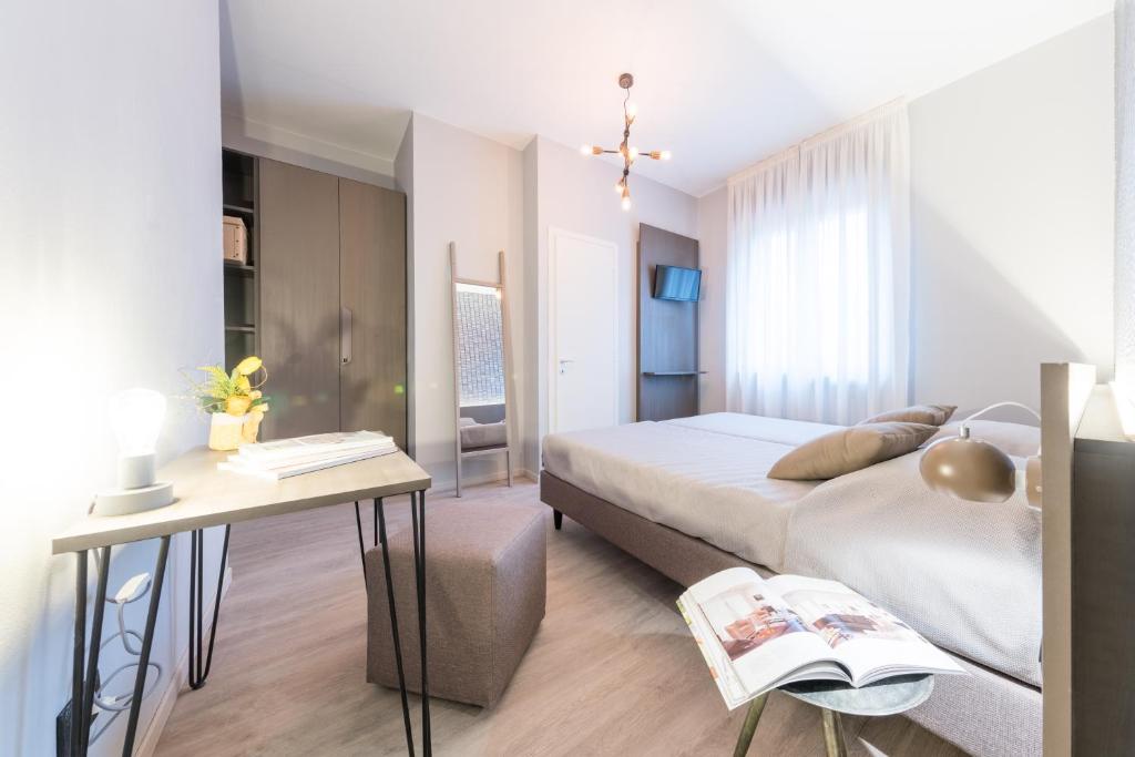 Postel nebo postele na pokoji v ubytování Hotel La Diga Altomincio