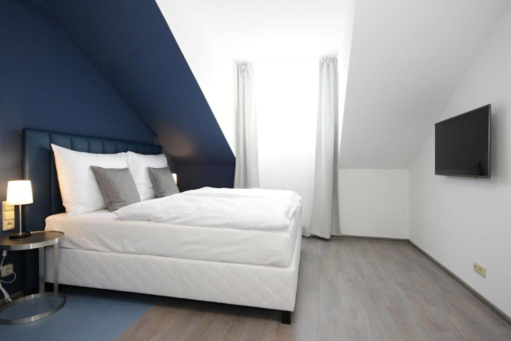 Łóżko lub łóżka w pokoju w obiekcie Alveo Suites