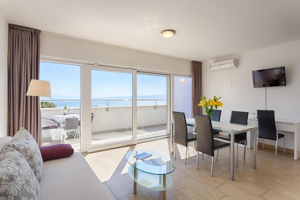 TV a/nebo společenská místnost v ubytování Adriatic Queen Rooms & Apartments