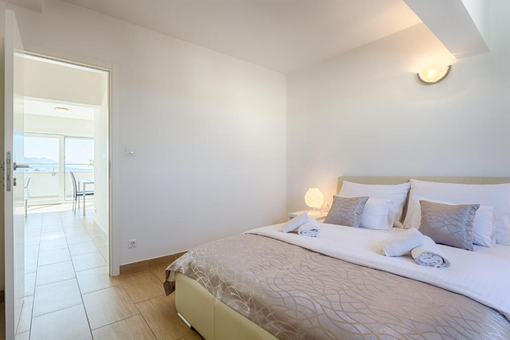 Postel nebo postele na pokoji v ubytování Adriatic Queen Rooms & Apartments