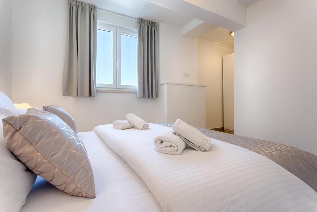 Postel nebo postele na pokoji v ubytování Adriatic Queen Rooms & Apartments