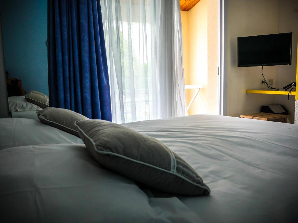 Postel nebo postele na pokoji v ubytování Village Vacances Passion Ré La Blanche